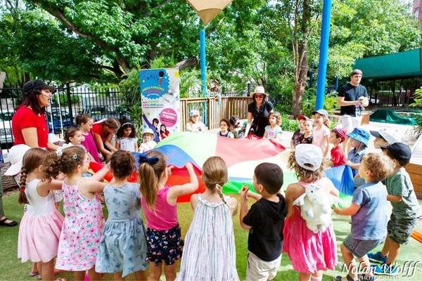 Professional Entertainer and Children at outdoor Park Party hosted by Bop till you Drop